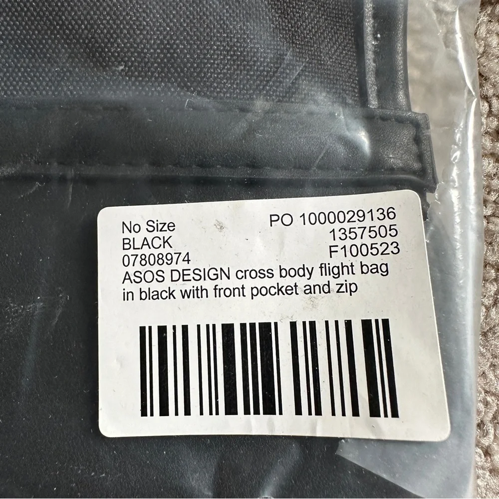 NWT ASOS DESIGN cross body flight bag in black with front pocket and zip